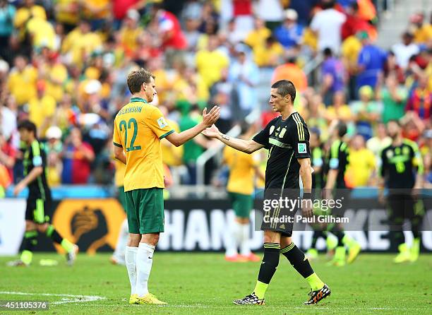 Alex Wilkinson of Australia and Fernando Torres of Spain shake hands after Spain's 3-0 win during the 2014 FIFA World Cup Brazil Group B match...