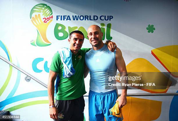 Tim Cahill of Australia and Pepe Reina of Spain pose for photographs after the 2014 FIFA World Cup Brazil Group B match between Australia and Spain...