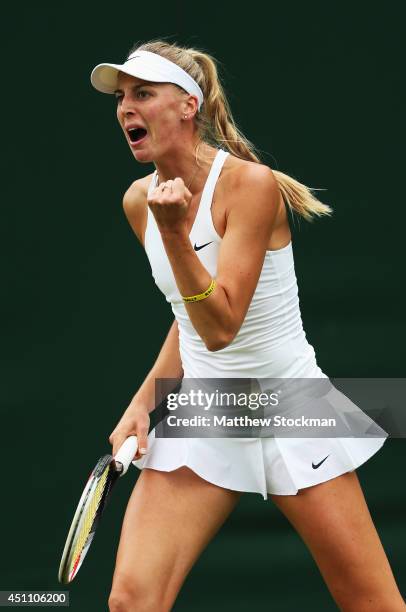 Naomi Broady of Great Britain celebrates during her Ladies' Singles first round match against Timea Babos of Hungary on day one of the Wimbledon Lawn...