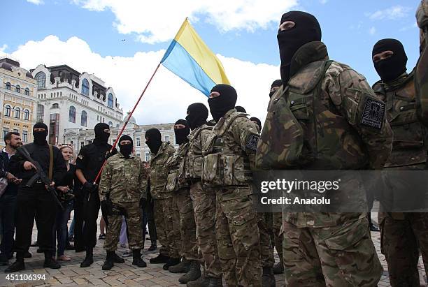 Ukrainian volunteer recruits of battalion 'Azov' attend an oath of allegiance ceremony near the monument to Bogdan Khmelnitsky in the center of Kiev,...