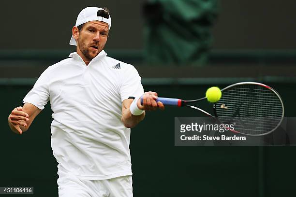 Jurgen Melzer of Austria plays a forehand during his Gentlemen's Singles first round match against Jo-Wilfried Tsonga of France on day one of the...
