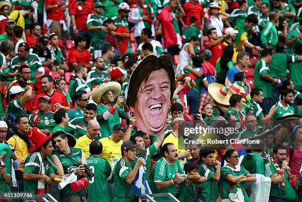 Mexico fans hold up a cutout of head coach Miguel Herrera during the 2014 FIFA World Cup Brazil Group A match between Croatia and Mexico at Arena...