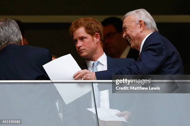 Prince Harry and CBF President Jose Maria Marin look on during the 2014 FIFA World Cup Brazil Group A match between Cameroon and Brazil at Estadio...