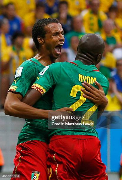 Joel Matip of Cameroon celebrates scoring his team's first goal with Allan Nyom during the 2014 FIFA World Cup Brazil Group A match between Cameroon...