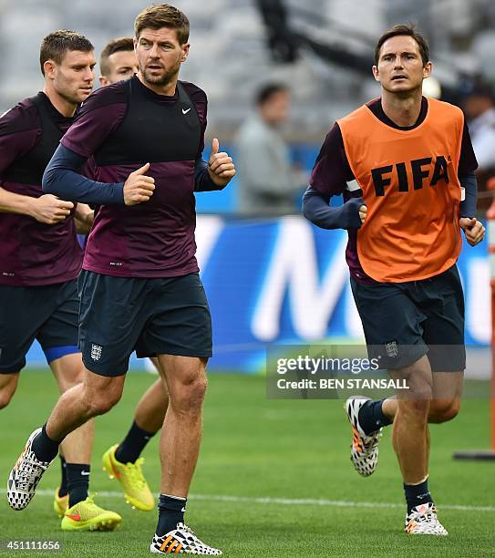 England's midfielder Steven Gerrard and midfielder Frank Lampard attend a training session at the Mineirao Stadium in Belo Horizonte on June 23 on...