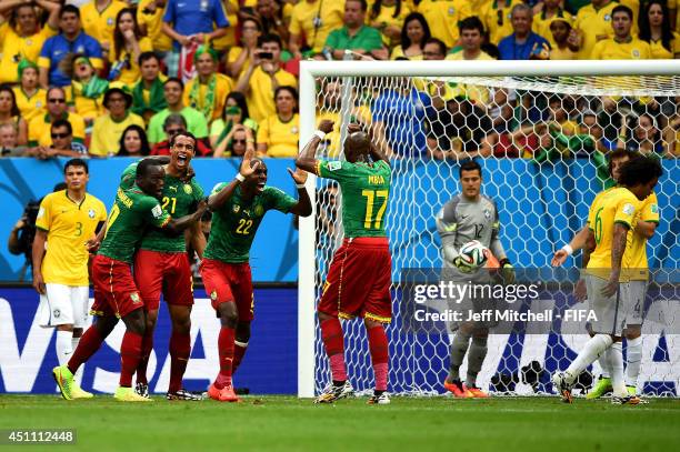 Joel Matip of Cameroon celebrates scoring his team's third goal with his teammates Vincent Aboubakar , Allan Nyom and Stephane Mbia during the 2014...