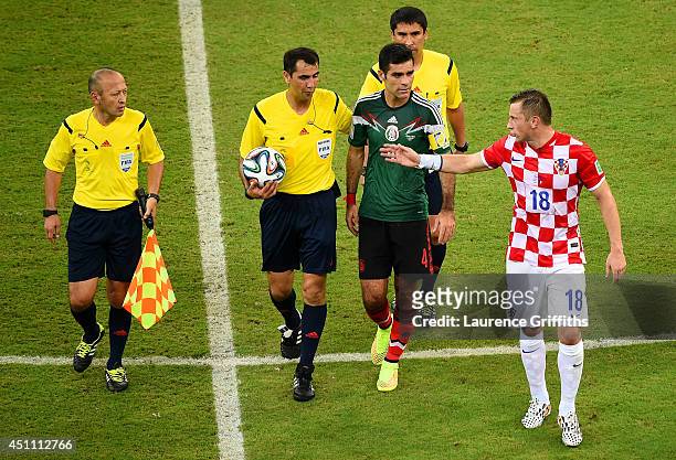 Ivica Olic of Croatia reacts toward referee Ravshan Irmatov as they leave the pitch at half-time during the 2014 FIFA World Cup Brazil Group A match...