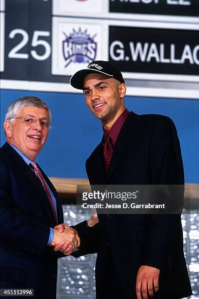 Tony Parker poses with David Stern after being drafted by the San Antonio Spurs on June 27, 2001 at The Theater at Madison Square Garden in New York,...