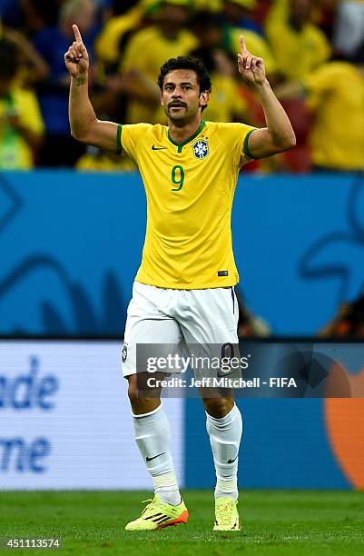 Fred of Brazil celebrates scoring his team's third goal during the 2014 FIFA World Cup Brazil Group A match between Cameroon and Brazil at Estadio...