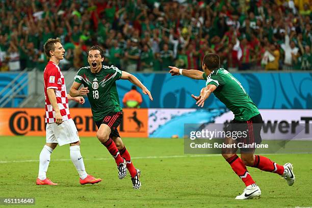 Andres Guardado of Mexico celebrates scoring his team's second goal during the 2014 FIFA World Cup Brazil Group A match between Croatia and Mexico at...