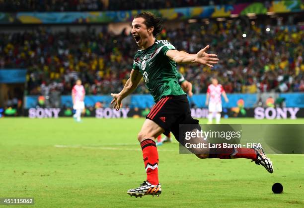 Andres Guardado of Mexico celebrates scoring his team's second goal during the 2014 FIFA World Cup Brazil Group A match between Croatia and Mexico at...