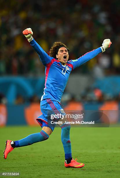 Guillermo Ochoa of Mexico celebrates his team's first goal during the 2014 FIFA World Cup Brazil Group A match between Croatia and Mexico at Arena...