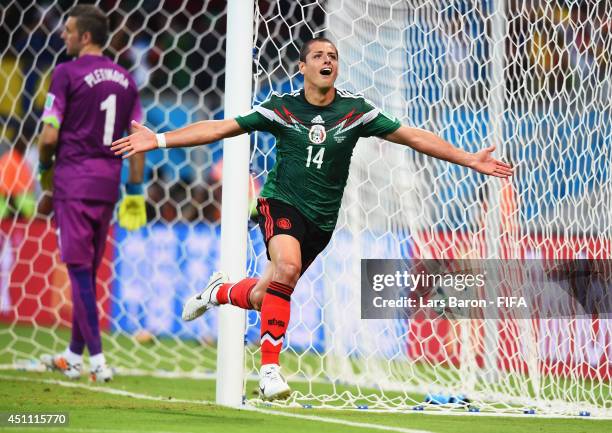 Javier Hernandez of Mexico celebrates scoring his team's third goal during the 2014 FIFA World Cup Brazil Group A match between Croatia and Mexico at...