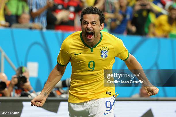 Fred of Brazil celebrates scoring his team's third goal during the 2014 FIFA World Cup Brazil Group A match between Cameroon and Brazil at Estadio...