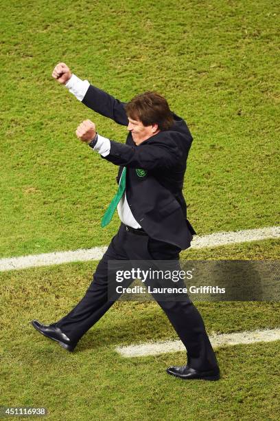 Head coach Miguel Herrera of Mexico celebrates victory in the 2014 FIFA World Cup Brazil Group A match between Croatia and Mexico at Arena Pernambuco...