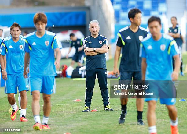 Alberto Zaccheroni coach of Japan watches his players as they practice during a Japan training session at Arena Pantanal on June 23, 2014 in Cuiaba,...