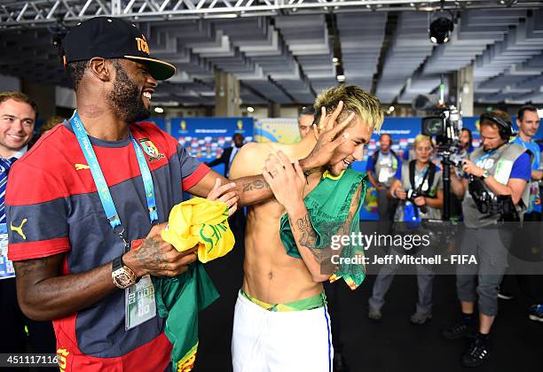 Neymar of Brazil speaks to Alexandre Song of Cameroon in the tunnel after the 2014 FIFA World Cup Brazil Group A match between Cameroon and Brazil at...