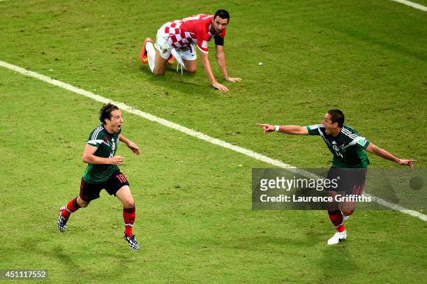 Andres Guardado of Mexico celebrates scoring his team's second goal during the 2014 FIFA World Cup Brazil Group A match between Croatia and Mexico at...