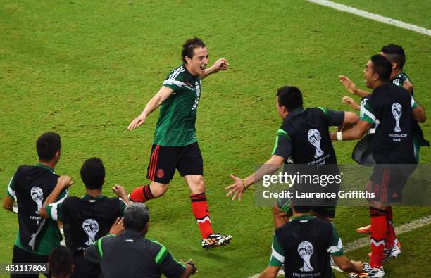 Andres Guardado of Mexico celebrates scoring his team's second goal during the 2014 FIFA World Cup Brazil Group A match between Croatia and Mexico at...