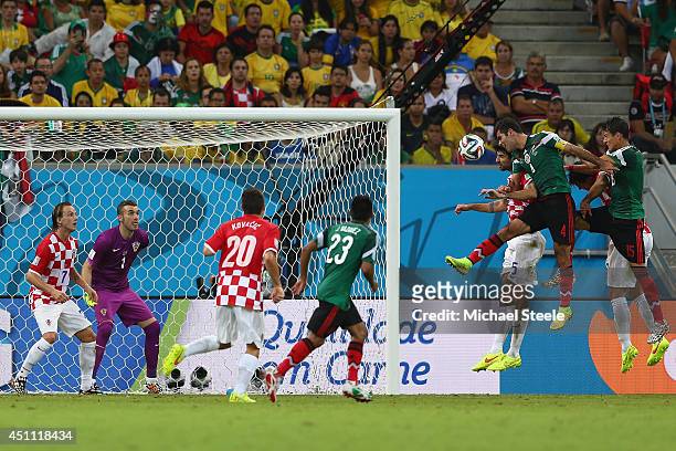 Rafael Marquez of Mexico scores his team's first goal during the 2014FIFA World Cup Group A match between Croatia and Mexico at Arena Pernambuco on...