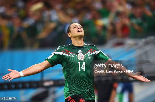 Javier Hernandez of Mexico celebrates scoring his team's third goal during the 2014 FIFA World Cup Brazil Group A match between Croatia and Mexico at...