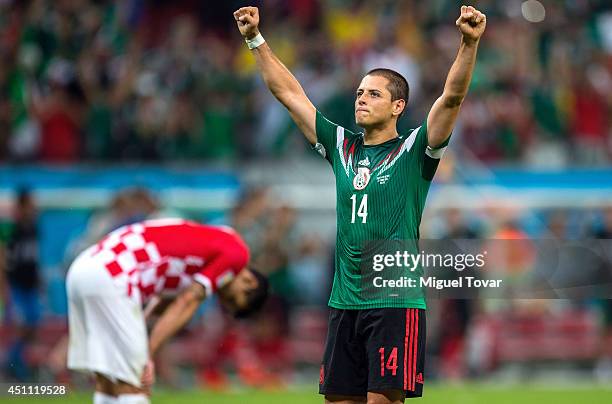 Javier Hernandez of Mexico celebrates scoring his team's third goal during the 2014 FIFA World Cup Brazil Group A match between Croatia and Mexico at...