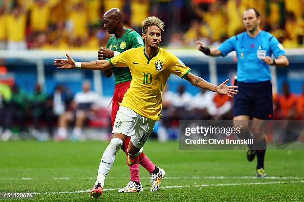 Neymar of Brazil celebrates scoring his team's second goal and his second of the game during the 2014 FIFA World Cup Brazil Group A match between...