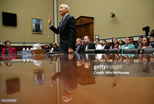 Internal Revenue Service Commissioner John Koskinen is sworn in prior to testifying before the House Oversight and Government Reform Committee June...