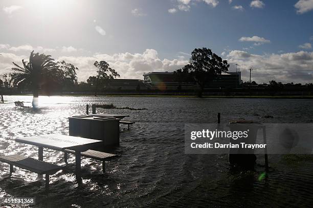 Picnic area opposite Flemington racecourse is flooded as the maribyrnong river overflows on June 24, 2014 in Melbourne, Australia. Almost 80,000...