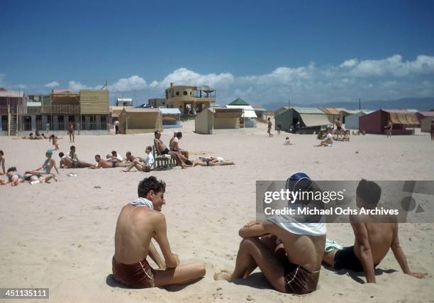 View of young boys resting on a beach in Beirut, Lebanon.