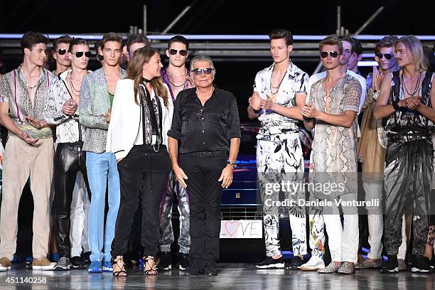 Designer Eva Cavalli and Roberto Cavalli acknowledge the applause of the audience after the Roberto Cavalli show as part of Milan Fashion Week...