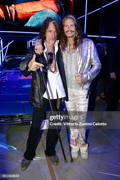 Joe Perry and Steven Tyler attend the Roberto Cavalli show during the Milan Menswear Fashion Week Spring Summer 2015 on June 24, 2014 in Milan, Italy.