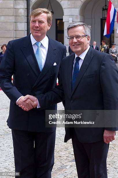 King Willem-Alexander is greeted by Bronislaw Komorowski President of Poland at the Presidential Palace during a trip to Poland on June 24, 2014 in...