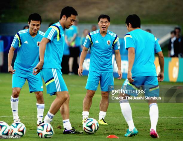 Yasuyuki Konno, Maya Yoshida, Shinji Okazaki and Makoto Hasebe are seen during a Japan official training session at Arena Pantanal on June 23, 2014...