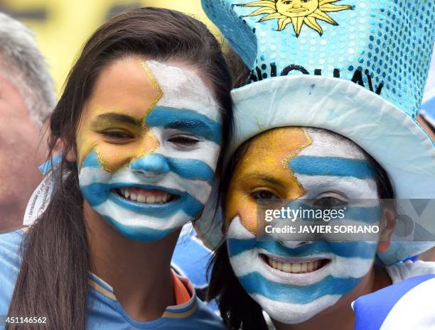 Uruguayan fans smile prior to a Group D football match between Italy and Uruguay at the Dunas Arena in Natal during the 2014 FIFA World Cup on June...