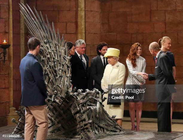 Queen Elizabeth II meets cast members of the HBO TV series 'Game of Thrones' Lena Headey and Conleth Hill while Prince Philip, Duke of Edinburgh...