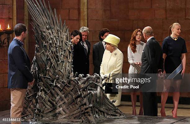 Queen Elizabeth II meets cast members of the HBO TV series 'Game of Thrones' Lena Headey and Conleth Hill while Prince Philip, Duke of Edinburgh...
