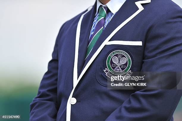 Picture shows the emblem on the front of the jacket of an umpire on day two of the 2014 Wimbledon Championships at The All England Tennis Club in...