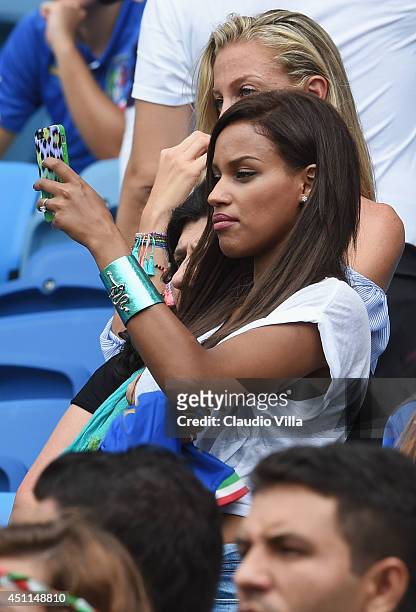 Mario Balotelli's girlfriend Fanny Neguesha takes a photograph prior to the 2014 FIFA World Cup Brazil Group D match between Italy and Uruguay at...