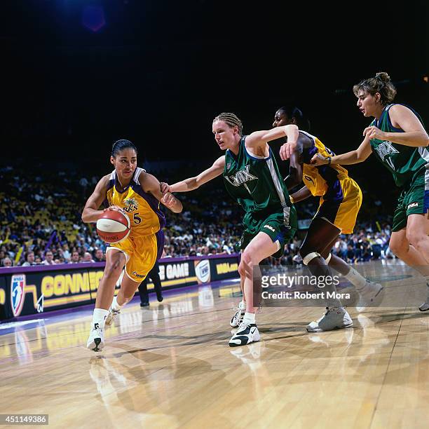 Allison Feaster of the Los Angeles Sparks drives against the Minnesota Lynx at Staples Center on June 24, 1999 in Los Angeles, CA. NOTE TO USER: User...