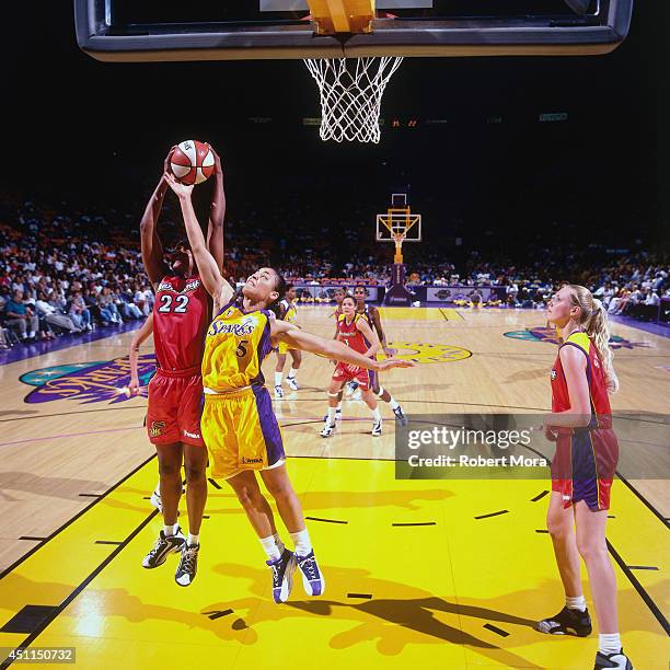 Allison Feaster of the Los Angeles Sparks grabs a rebound against the Phoenix Mercury at Staples Center on July 21, 1999 in Los Angeles, CA. NOTE TO...