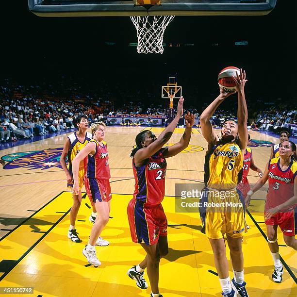 Allison Feaster of the Los Angeles Sparks grabs a shoots against the Phoenix Mercury at Staples Center on July 21, 1999 in Los Angeles, CA. NOTE TO...