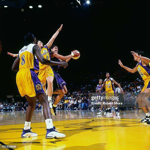 Ticha Penicheiro of the Sacramento Monarchs shoots against the Los Angeles Sparks at Staples Center on July 9, 1999 in Los Angeles, California. NOTE...