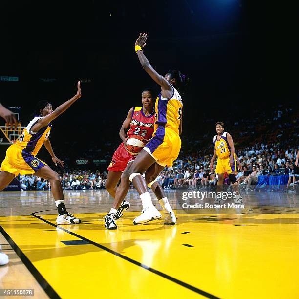 Jennifer Gillom of the Phoenix Mercury drives against the Los Angeles Sparks at Staples Center on July 11, 1999 in Los Angeles, CA. NOTE TO USER:...