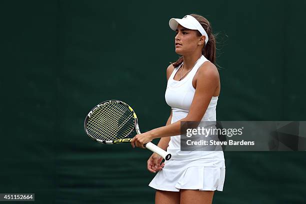 Monica Puig of Puerto Rico in action during her Ladies' Singles first round match against against Madison Keys of the United States on day two of the...