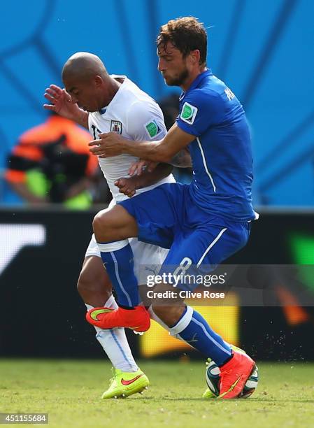Claudio Marchisio of Italy fouls Egidio Arevalo Rios of Uruguay and is sent off during the 2014 FIFA World Cup Brazil Group D match between Italy and...