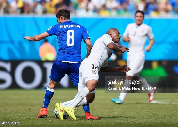Egidio Arevalo Rios of Uruguay is tackled by Claudio Marchisio of Italy which ends up a red card to Marchisio during the 2014 FIFA World Cup Brazil...