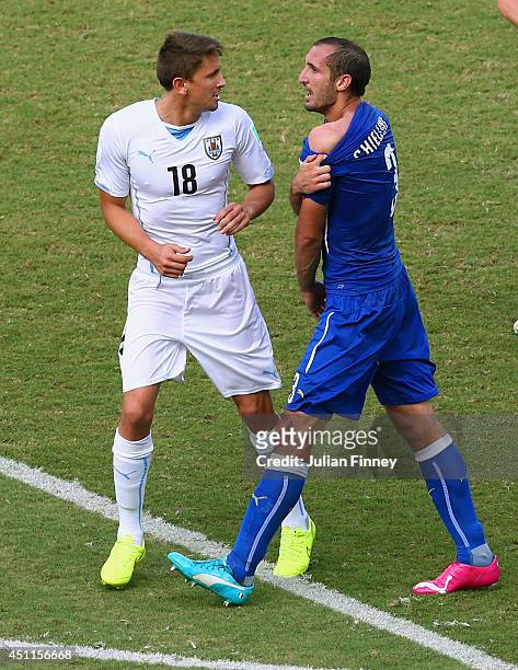 Giorgio Chiellini of Italy pulls down his shirt after a clash with Luis Suarez of Uruguay during the 2014 FIFA World Cup Brazil Group D match between...