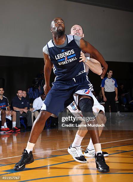 Melvin Ely of the Texas Legends boxes out Chad Gillaspy of the Tulsa 66ers during an NBA D-League preseason game on November 14, 2013 at Integrated...