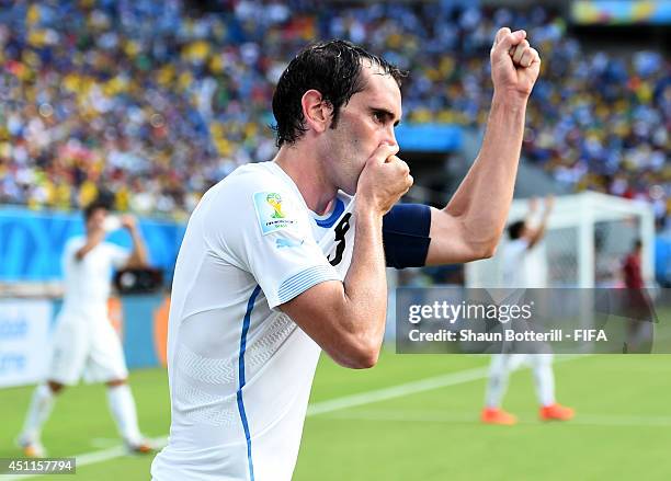 Diego Godin of Uruguay celebrates scoring his team's first goal during the 2014 FIFA World Cup Brazil Group D match between Italy and Uruguay at...